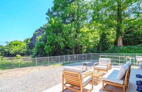Kawazu House | House surrounded by trees with a dog run/Kamogun Shizuoka