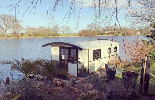 Lathum Boat Rental | Houseboat in Lathumse Plas with Harbor Views