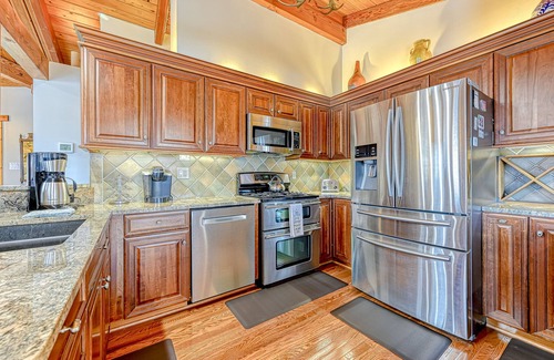 Louisa House | Huge lakefront home with A/C, sunroom, boat ramp, WIFI,game room, deck, & kayaks