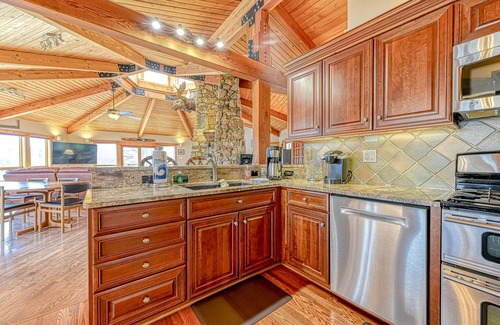 Louisa House | Huge lakefront home with A/C, sunroom, boat ramp, WIFI,game room, deck, & kayaks