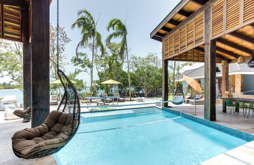 Placencia House | Hummingbird: Beachfront Cabana with Private Veranda on Belize Private Island