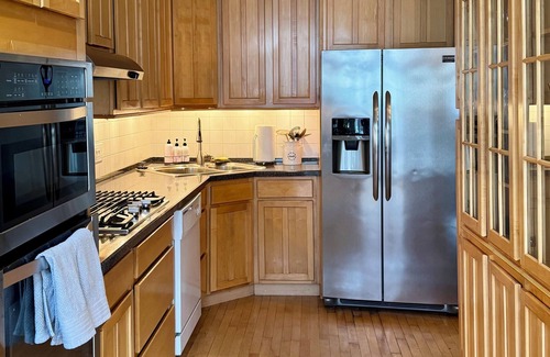 Old Town House | Ideal Group Getaway: Prime Location, Parking, Backyard, Sunroom & Pet-Friendly