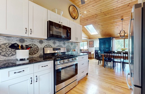 Manchester House | Idyllic & sunny lakefront home with large patio & views - near golf & skiing