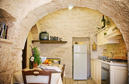 Martina Franca House | Il Ciliegeto: 1800s trullo house with views of pool, vineyard and Itria Valley