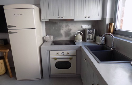 Pyrgos House | Imarkellis Pyrgos Traditional House and Belfry Charm with Courtyard in Santorini