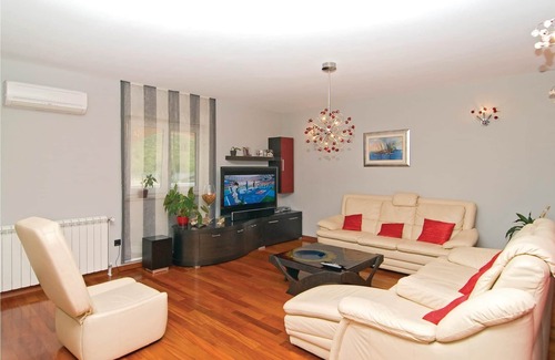 Seget House | In a small quiet place in a large garden is located this cottage with nicely furnished interiors.