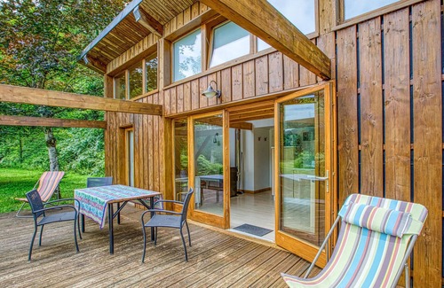 Mirandol-Bourgnounac House | In idyllic location of a forest and near the river Vaur is this cozy wooden house.