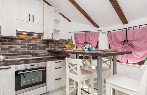 Viskovo Apartment | In Viskovo, a suburb of Rijeka, lies this lovingly and modernly furnished attic apartment.