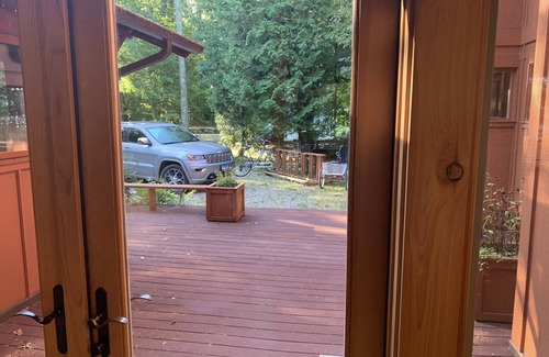 Beaver Island Cottage | Indoor/outdoor living at its best in this stunning lakeside home.