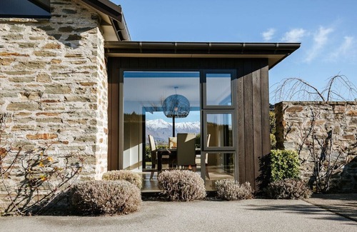 Wanaka House | Infinity Drive · Modern, luxury home with a hot tub and lake views.
