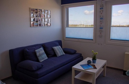 Fehmarn Apartment | Inselblume 65 - vacation home by the sea, view to the marina