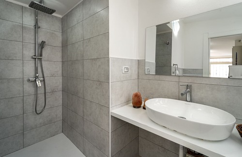 Carbonia House | Intimate, quiet studio apartment with a small living room and equipped kitchen