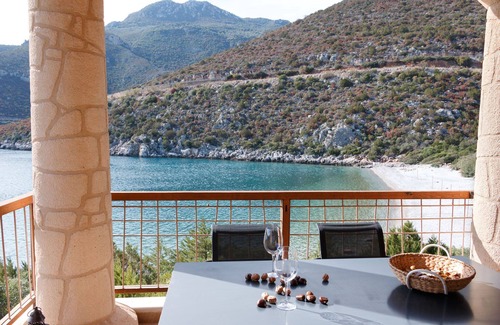 Arkadiko Chorio Apartment | Into The Blue Maisonette: A beautiful stone house on the beach!