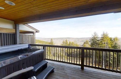 Snowshoe House | Inviting 8BR Alpine Getaway with Private Hot Tub by RedAwning