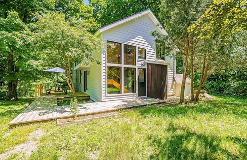 Benzonia House | Inviting home in great location with large deck, firepit, gas grill & streaming