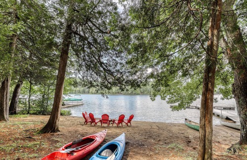 Adirondack House | Inviting lakefront house with dock, sandy beach & screened porch