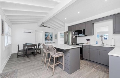 Englewood House | Island charm meets waterfront adventure! Private dock on a deep-water canal with quick Gulf access