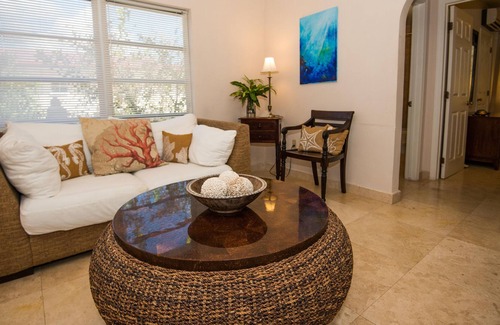 Cockburn Town Apartment | Island House: Modern suites w/ pool, tropical gardens & incredible water views