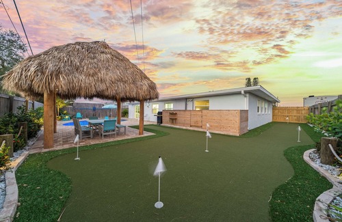 Surfside Estates House | Island Oasis with Heated Pool, Putt Putt Course, Tiki Bar, and Beach Gear!