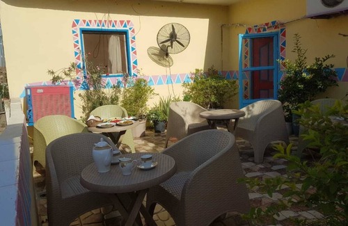Giza House | It's a house .it has aquit roof with a view of pyramids
