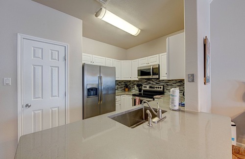 Safe Harbor Condo | Just a few blocks from the beach with a community pool. Sleeps 8!