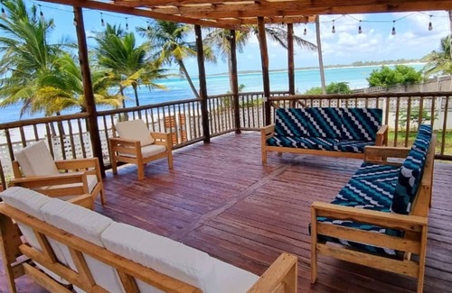 Upanga East Villa | Karibu Beach Villa - A private beach front home with a large pool and gardennn