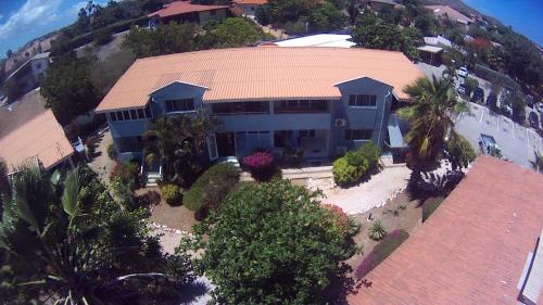 Willemstad Apartment | Kas di BaMi A-194 op Seru Coral Resort - Ruim appartement met groot zwembad en tropische tuin