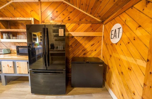 Northeast Somerset Cabin | Katahdin - Cabin 4 · Lawrence's Lakeside Cabins | 'Katahdin': Boat Dock + Kayaks