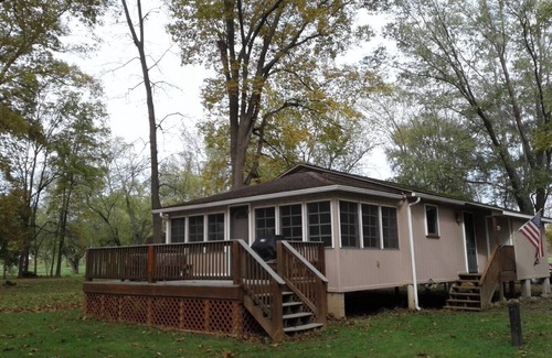 Fishertown Cottage | KD CottagesnPrivate 2-bedroom tan cottage on Dunnings Creek, in Bedford County