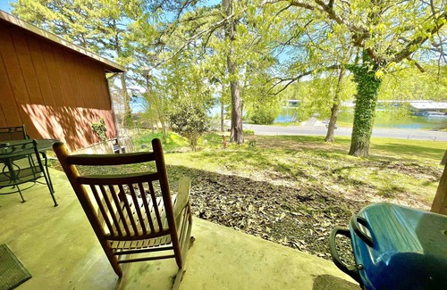 Mount Ida Apartment | King Studio with king bed, dining area, sleeper sofa and view of Lake Ouachita by RedAwning