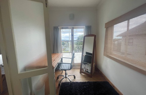 Stanmore Bay House | Kiwi Bach, sea views, near the beach. Fully fenced.
