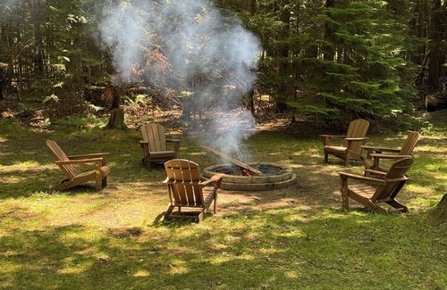 Prudenville Cabin | Knotty by Nature! Firepit and Parking! Less than a mile to trails and the lake!