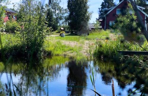 Skien House | Koselig hytte langs elven