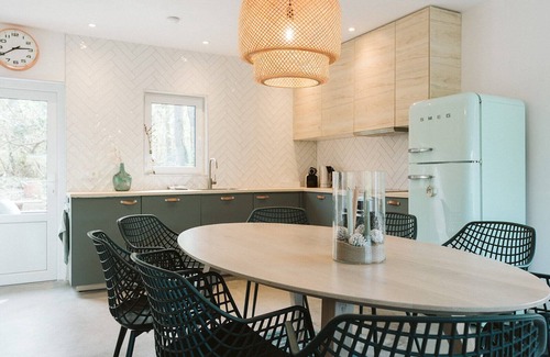 Ouddorp House | La Folie': a large, elegantly furnished holiday home with plenty of privacy at the back of a green family park.