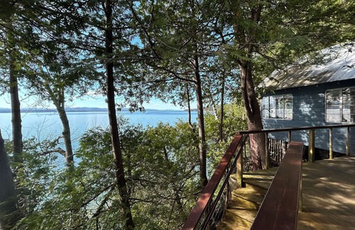 Charlotte Cabin | Lake Champlain camp, spacious deck, sunset & mountain views, beach and dock