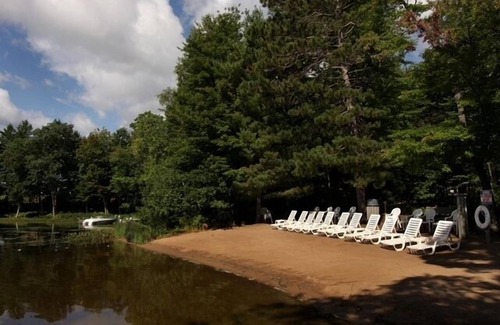 Eagle River Condo | Lake Forest Resort – Relax on a Pristine Sandy Beach in the Northwoods!
