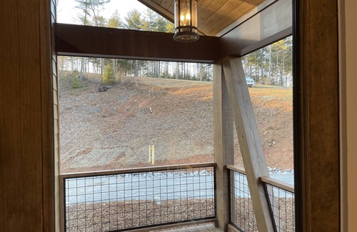 Nebo House | Lake front home with dock in a small cove with a beach.