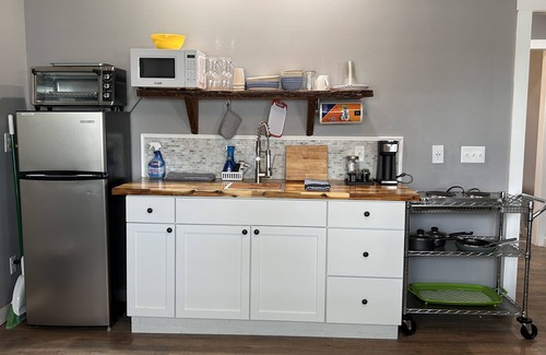 Southport Cottage | Lake Front Rental in Panama City with Kayak, EV Charger, & Dock - Dog Friendly