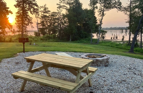 Southport Cottage | Lake Front Rental in Panama City with Kayak, EV Charger, & Dock - Dog Friendly