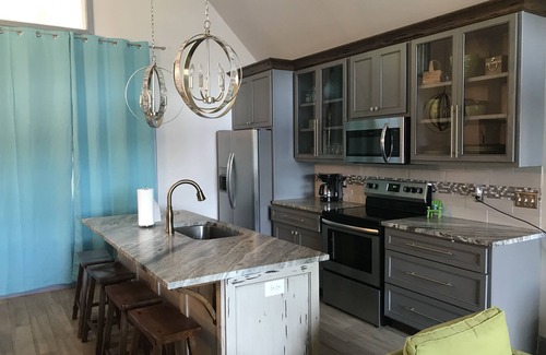Jacksons' Gap House | Lake Martin home, lakefront, renovated house, no stairs- beach area