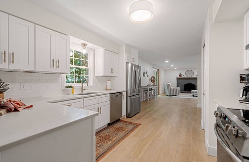 Norton Shores House | Lake MI Nest- perfect for group trips with access to Lake MI & private hot tub!
