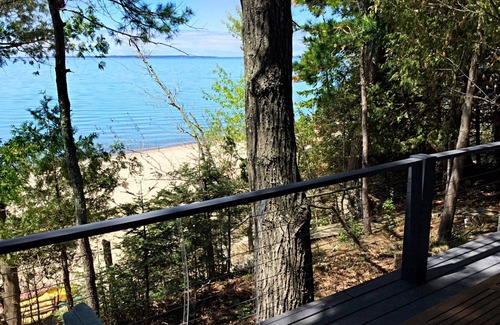 Ellsworth House | Lake Michigan Sunsets and sandy beachfront home on Grand Traverse Bay