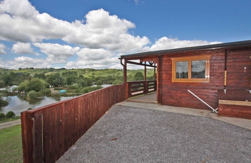 Pontardulais Cottage | Lake side log cabin peacefully situated and each enjoying fabulous lake views.