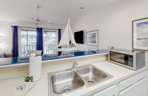 Little River Condo | Lake-view 3rd-floor condo with balcony, hot tub, outdoor pool, washer/dryer, AC