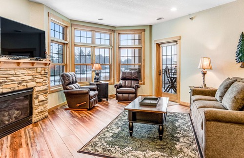 Three Lakes Condo | Lake view condo with 2 balconies, fireplace, pool, hot tubs, gym & sports courts