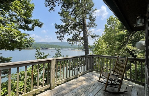 Mount Ida Cottage | Lake view two bedroom, two bath loft, log-sided cottage with private hot tub overlooking Lake Ouachita. by RedAwning