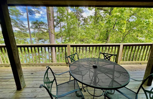 Mount Ida Cottage | Lake view two bedroom, two bath log-sided cottage with private hot tub overlooking Lake Ouachita. by RedAwning