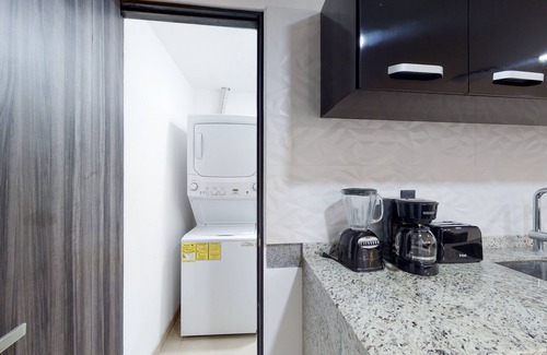 Downtown Cancun Apartment | Lakefront apartment with pool, fitness room, washer/dryer, & patio