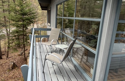 Three Lakes Cottage | Lakefront Cabin on Virgin Lake w/kayaks, lily pad, firepit, sandy swimming area