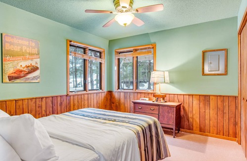 Three Lakes Cabin | Lakefront cabin with lake views, wood stove, hot tubs, heated pool, gym, golf